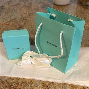 Tiffany and company jewelry box, gift bag and ribbon